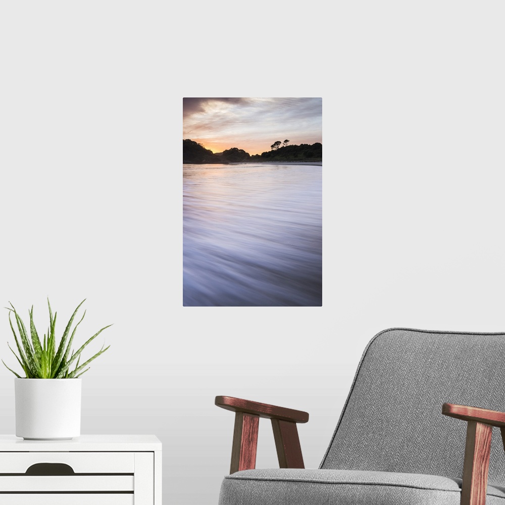 A modern room featuring Sunrise at Maitai Bay (Matai Bay), a popular beach on the Karikari Peninsula, Northland, New Zeal...