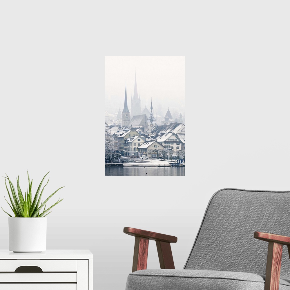 A modern room featuring The town of Zug on a misty winter day, Zug, Switzerland