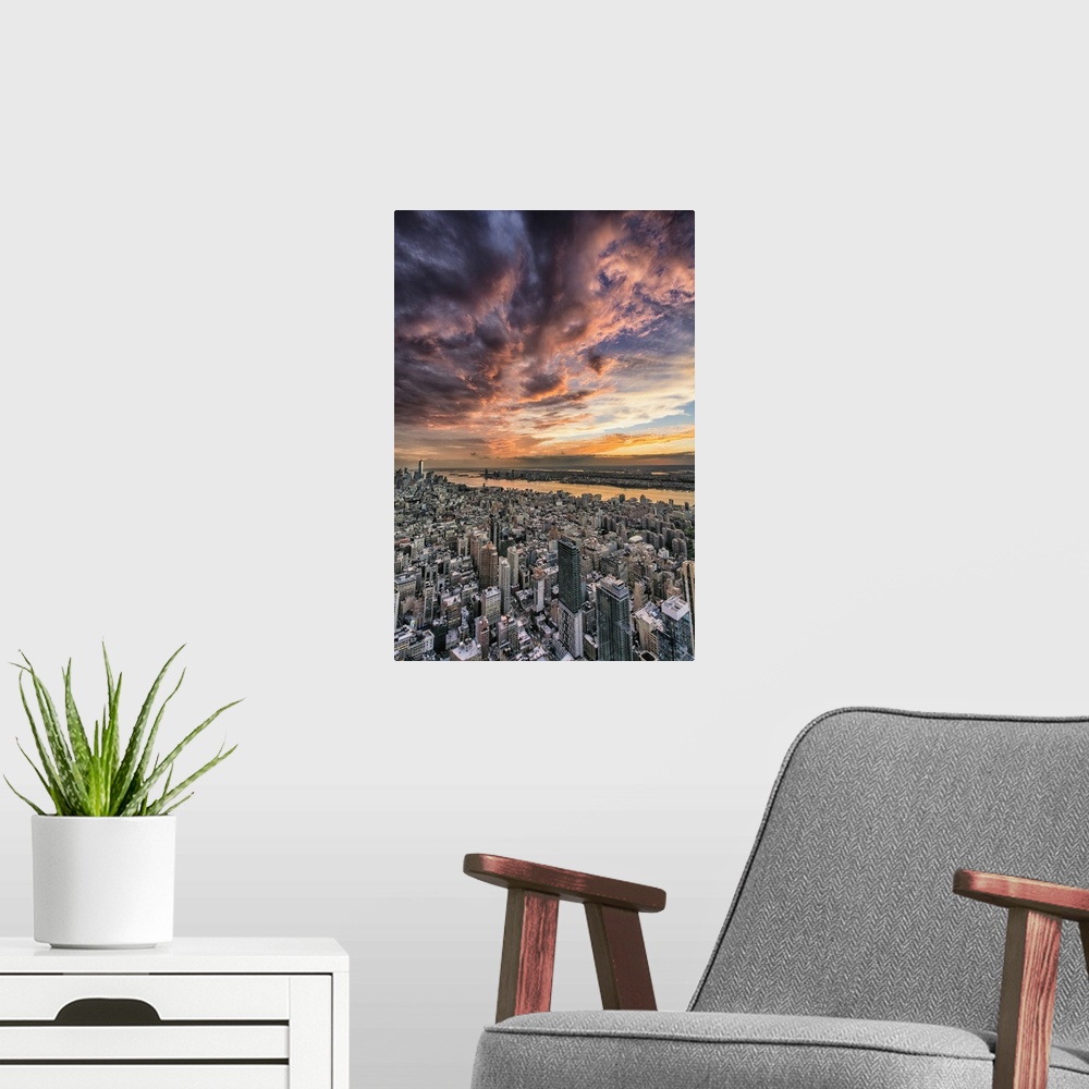 A modern room featuring Beautiful sunset with clouds from the Empire State Building.