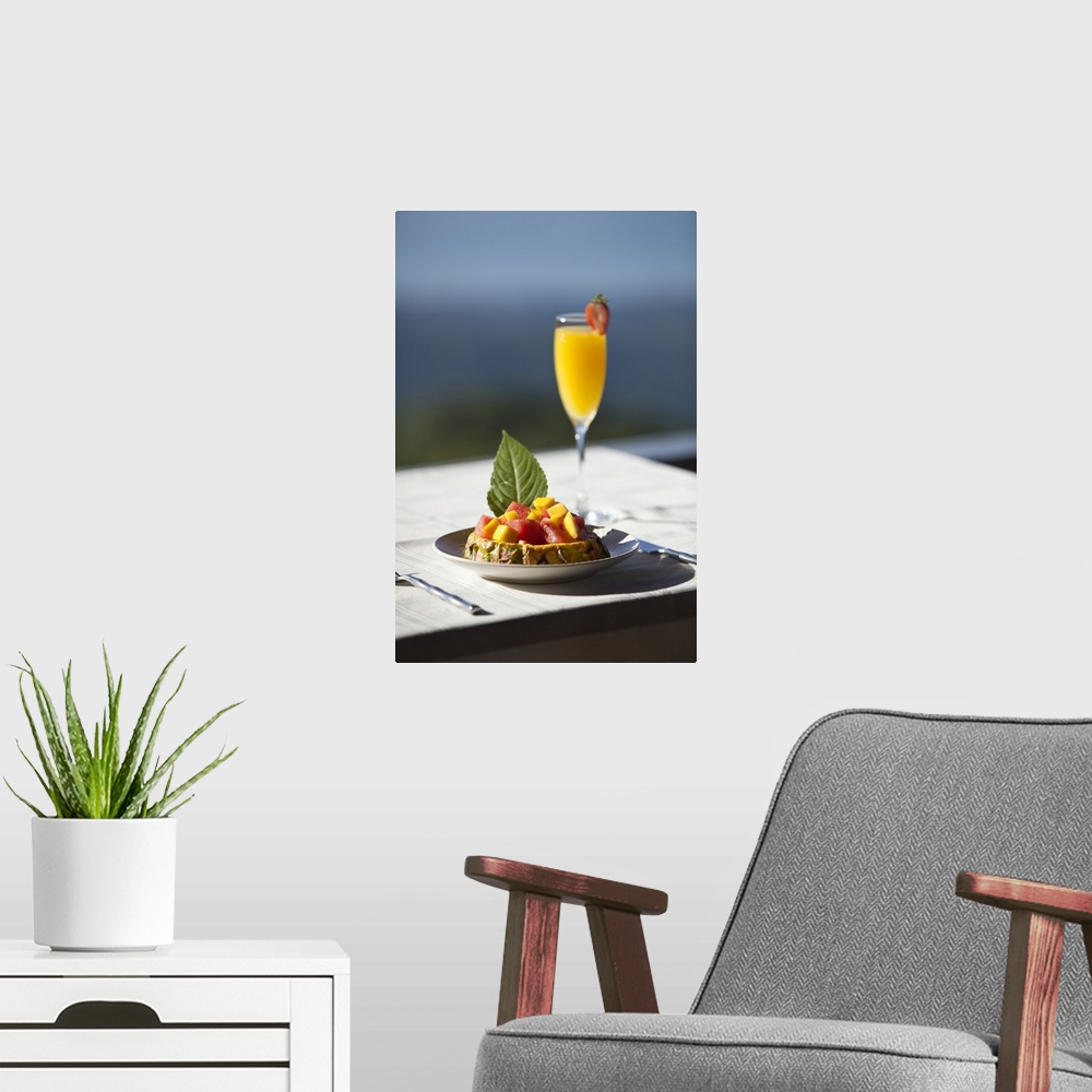 A modern room featuring Fruit and a mimosa in a restaurant with a view of the ocean, Costa Rica