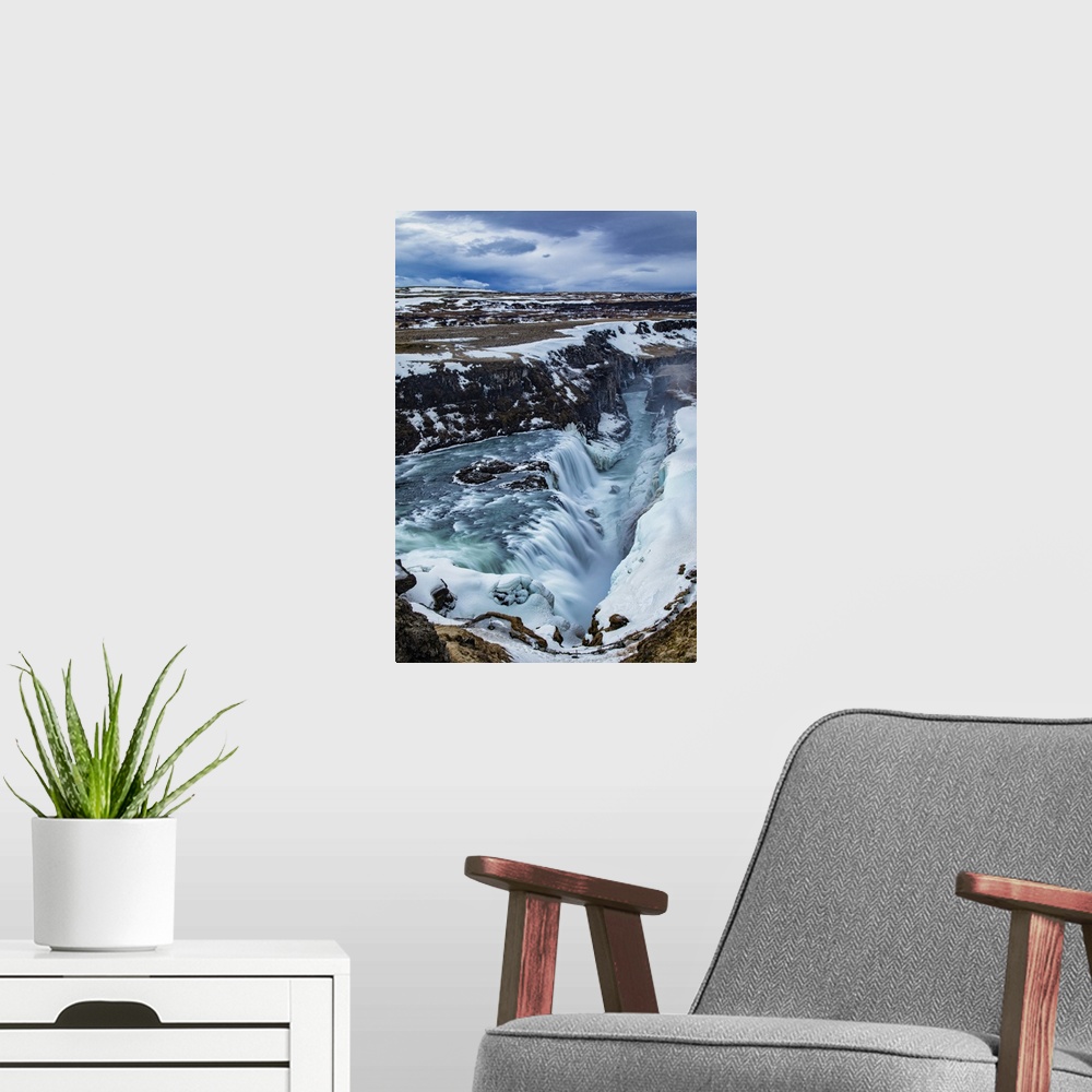 A modern room featuring Rushing water of Gullfoss Waterfall in Iceland.