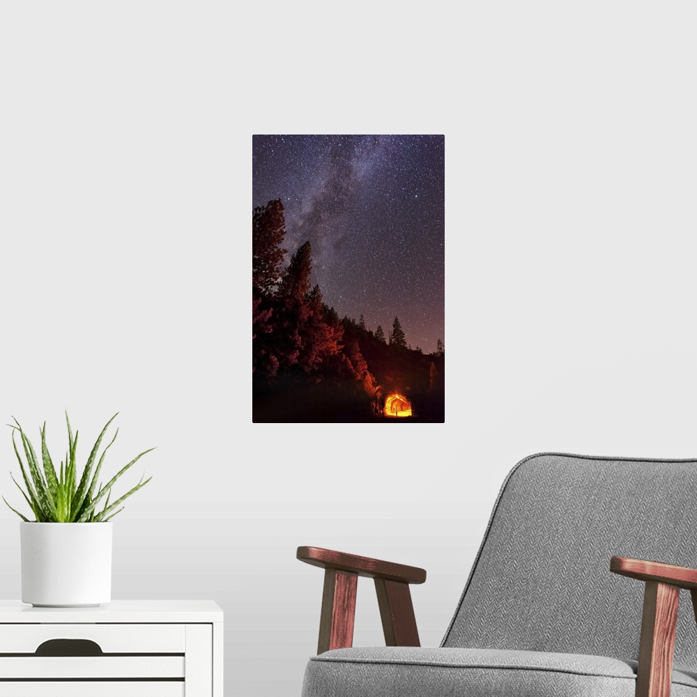 A modern room featuring The summer Milky Way rises over the mountain while the tunnel blazes with light in this long expo...