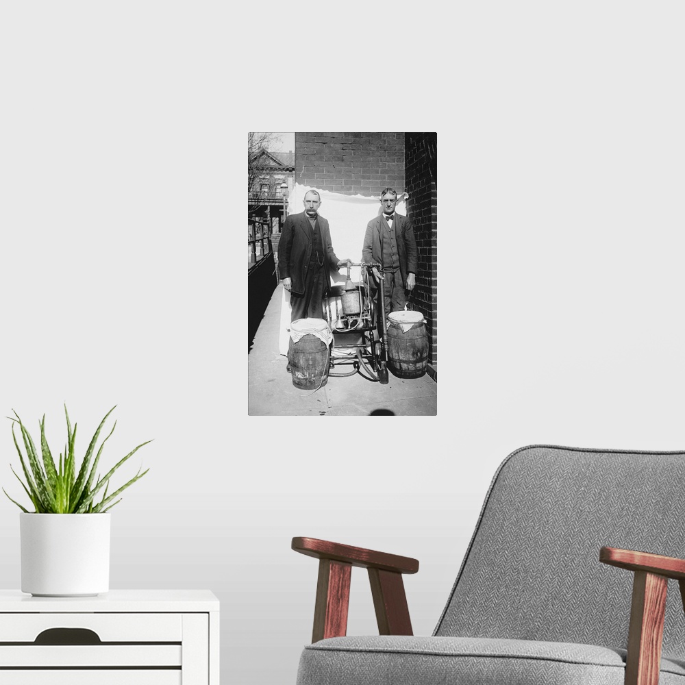 A modern room featuring Prohibition era photograph of two men posing with an illegal whiskey still.