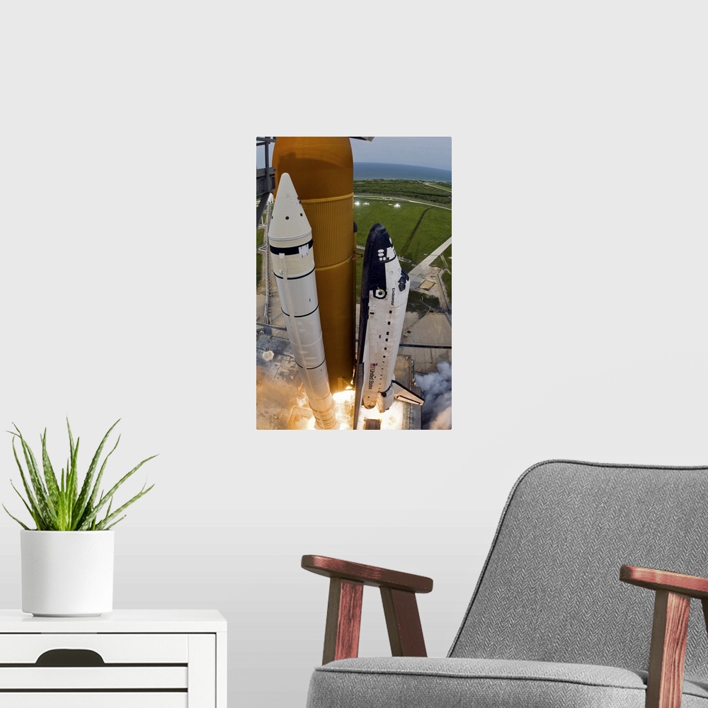 A modern room featuring Space Shuttle Endeavour lifts off from Kennedy Space Center