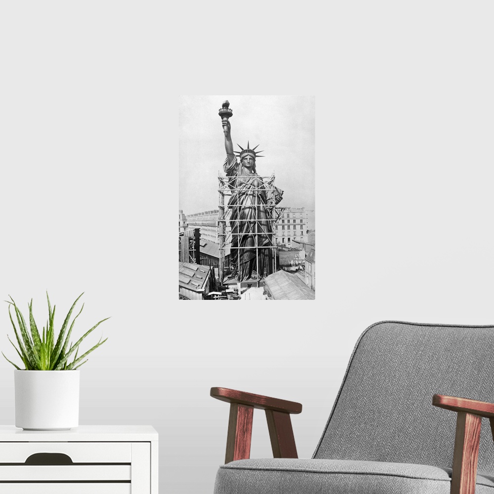A modern room featuring The Statue of Liberty while it was being constructed in Paris, France, under the direction of an ...