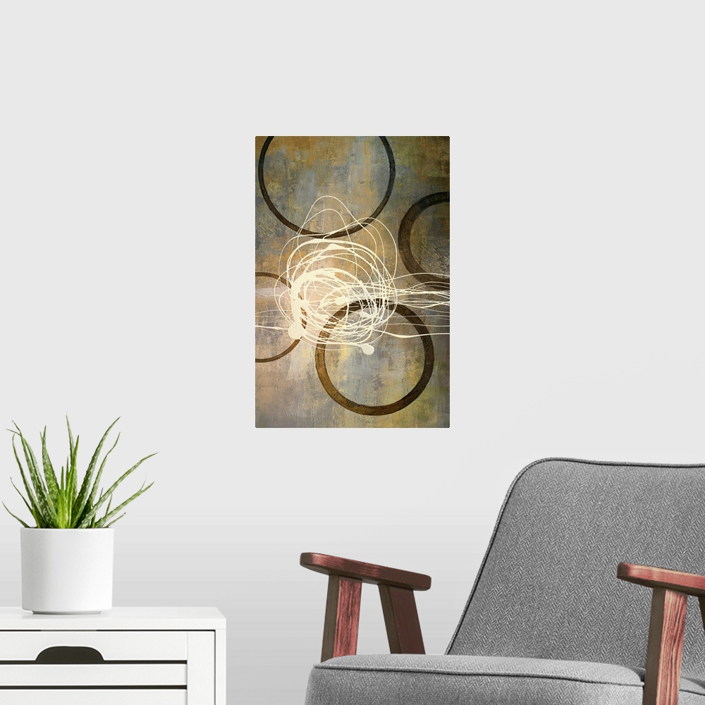 A modern room featuring Abstract artwork that consist of four brown circles with an off white scribble in the middle.