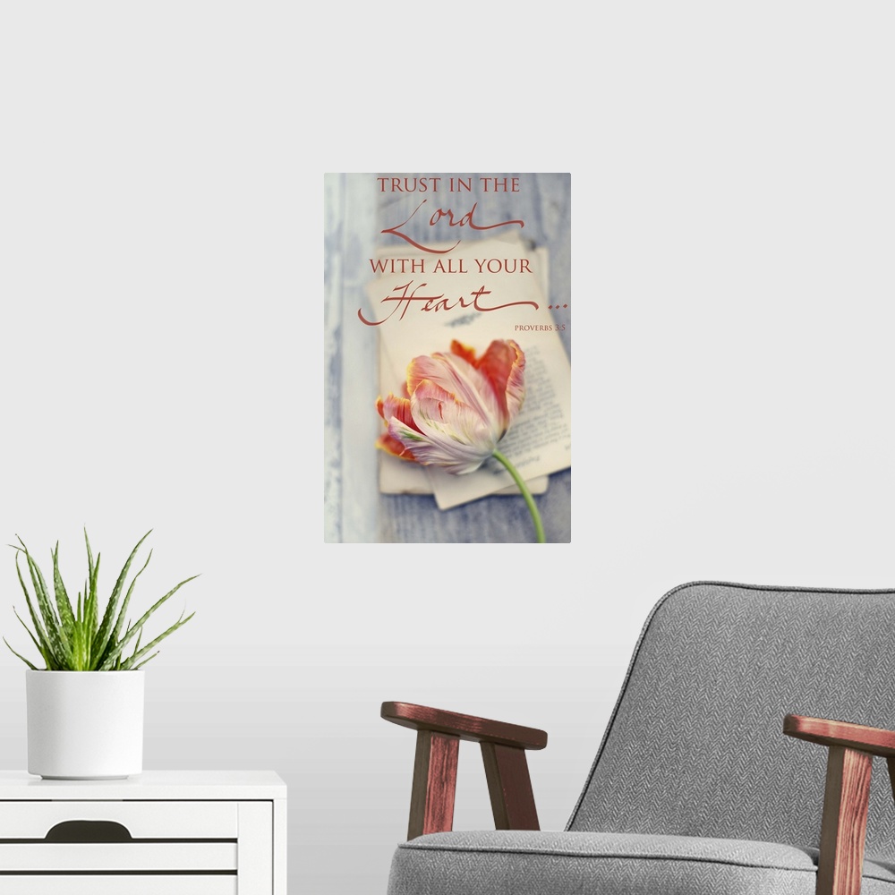 A modern room featuring Photograph of a flower laying on top of sheets of typed paper with the bible verse "Trust in the ...