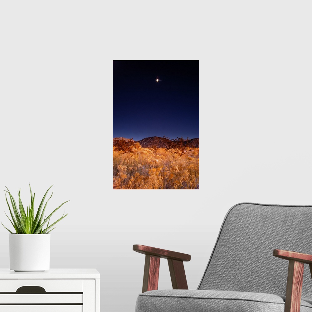 A modern room featuring Sandia mountains desert twilight landscape moon rise, New Mexico