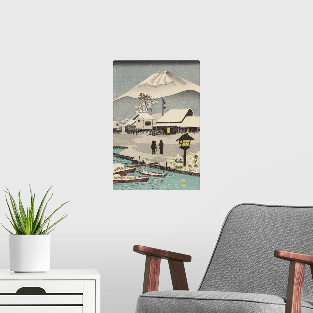 A modern room featuring Eastern art of snowy village scene with Mount Fuji in the background.