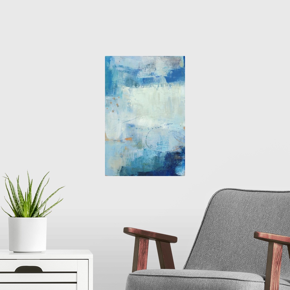 A modern room featuring Vertical abstract painting made in shades of blue with gold accents and lines etched in the thick...