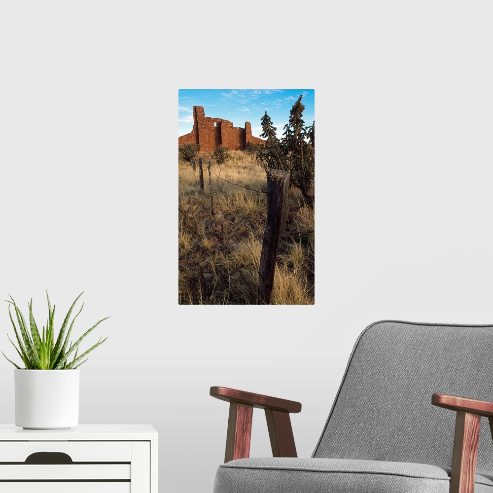 A modern room featuring Barbed-wire fence line, hilltop ruins, New Mexico
