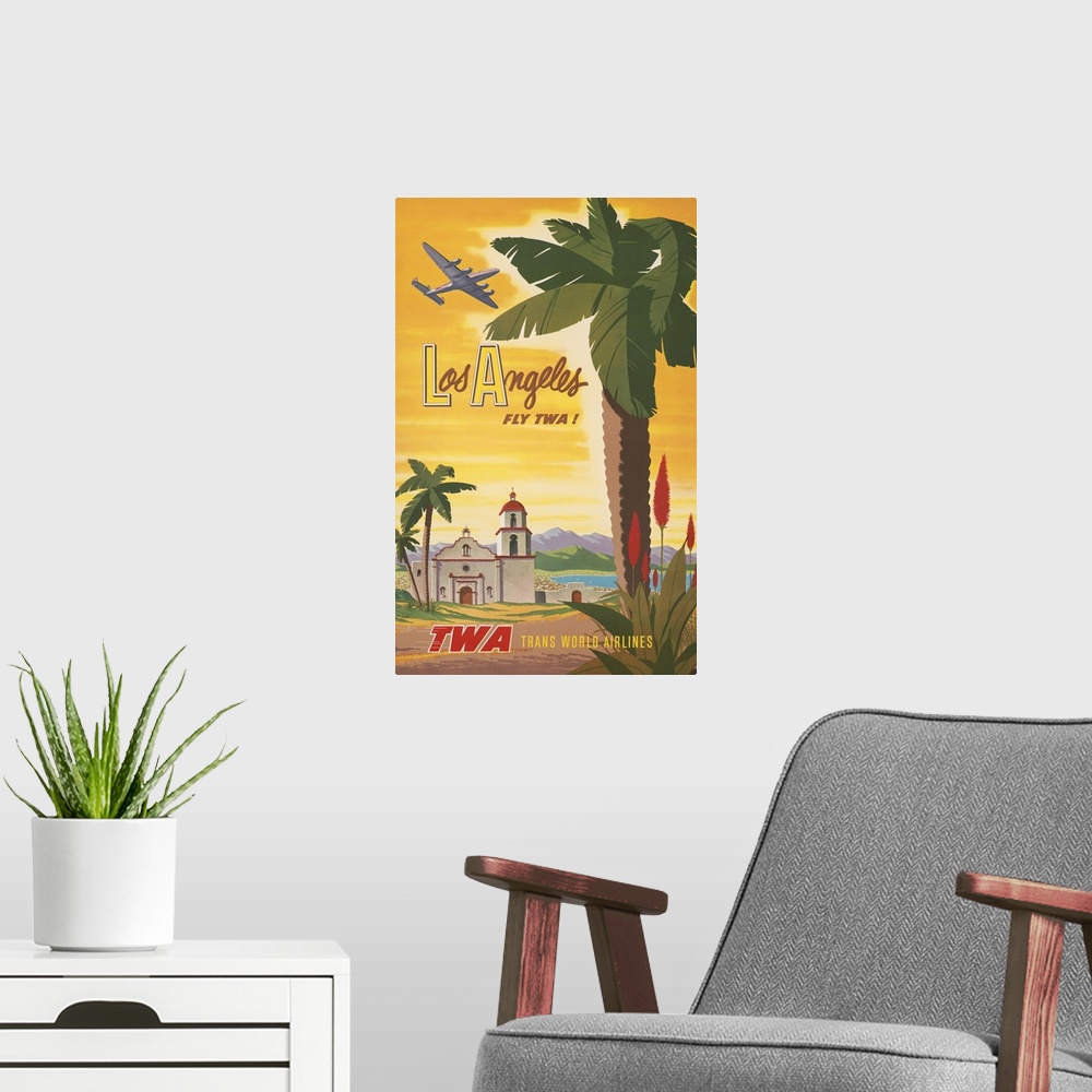 A modern room featuring Vintage travel poster, Fly TWA to Los Angeles, shows airplane flying over a Spanish mission churc...