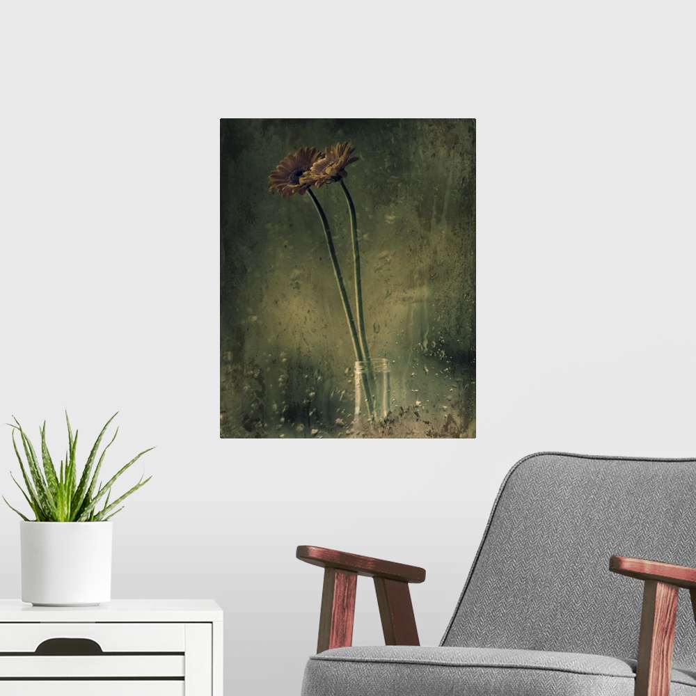 A modern room featuring Grungy photograph of long stem flowers in a small glass vase.