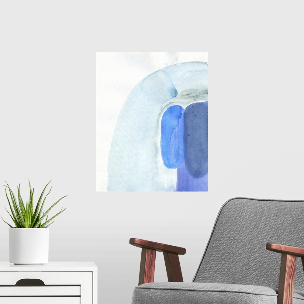 A modern room featuring Watercolor abstract artwork in shades of blue.