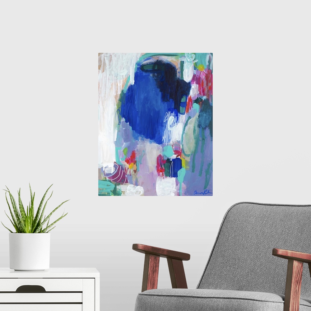 A modern room featuring Contemporary abstract art with deep blue tones and lighter turquoise and white.