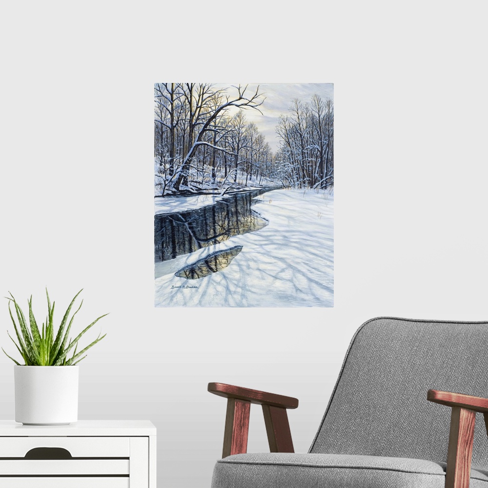 A modern room featuring Contemporary artwork of a winter forest scene with a partially frozen pond or stream.