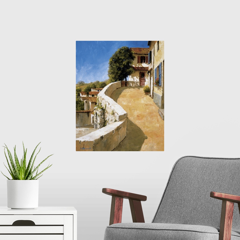 A modern room featuring Painting of a walkway in a European village.