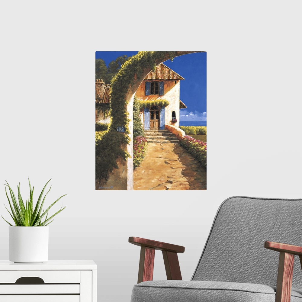 A modern room featuring Painting of a house in a rural village with a vine-covered archway.