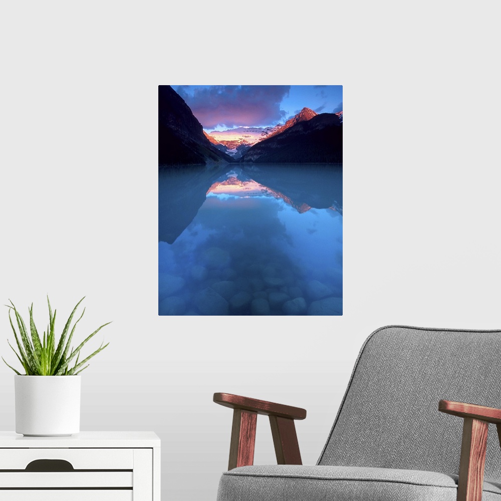 A modern room featuring Canada, Alberta, Banff National Park. Sunrise reflects Victoria Glacier on Lake Louise. Credit as...