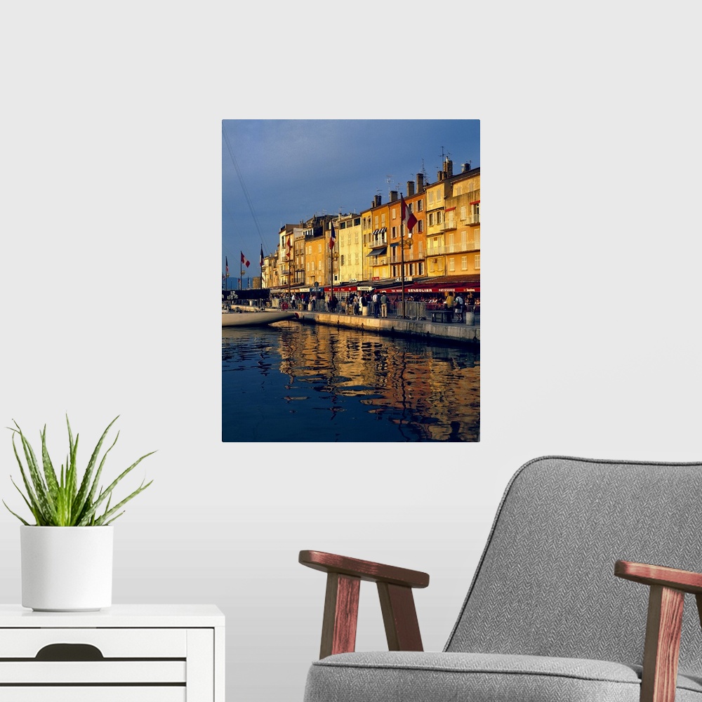 A modern room featuring Europe, France, St. Tropez. The cafes along the harbor are filled with people-watchers in St. Tro...