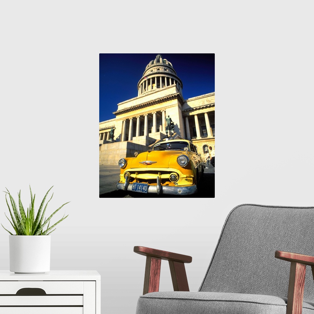 A modern room featuring Cuba, Havana, Vintage car in front of Capitolio Nacional
