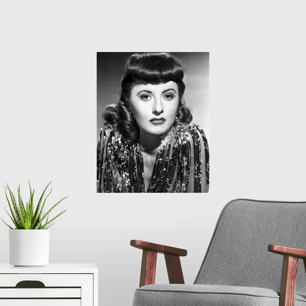 A modern room featuring Barbara Stanwyck in Ball Of Fire - Vintage Publicity Photo