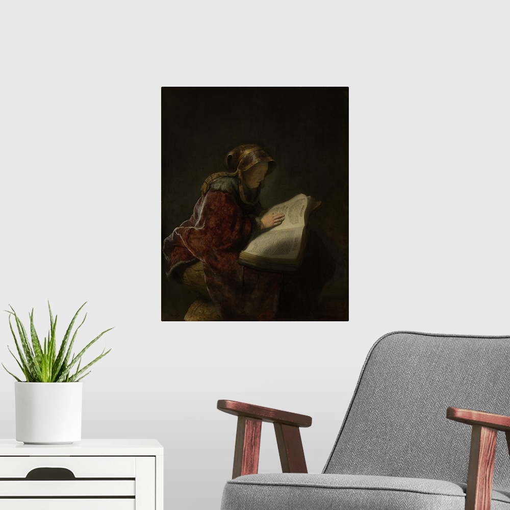 A modern room featuring Old Woman Reading, Probably the Prophetess Hannah, by Rembrandt, 1631, Dutch painting, oil on pan...
