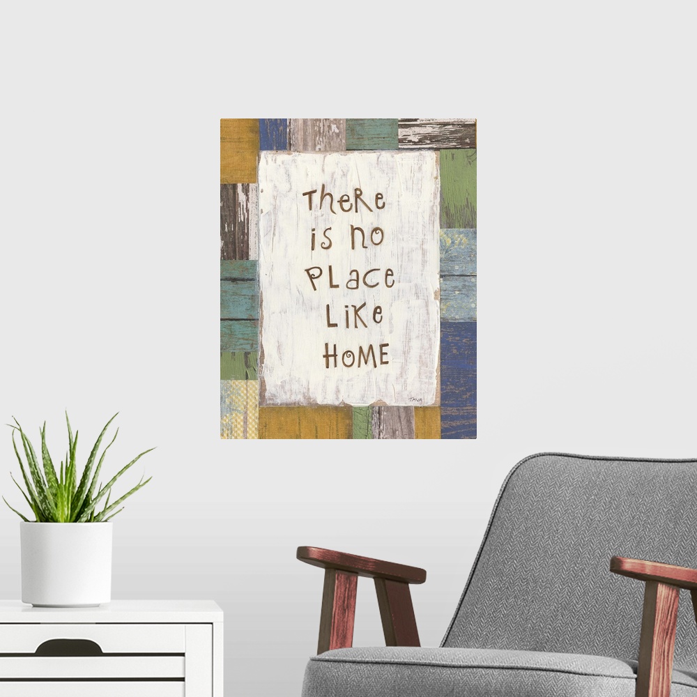 A modern room featuring A decorative painting that has ?There is no Place Like Home? painted on a multi-colored wood patt...