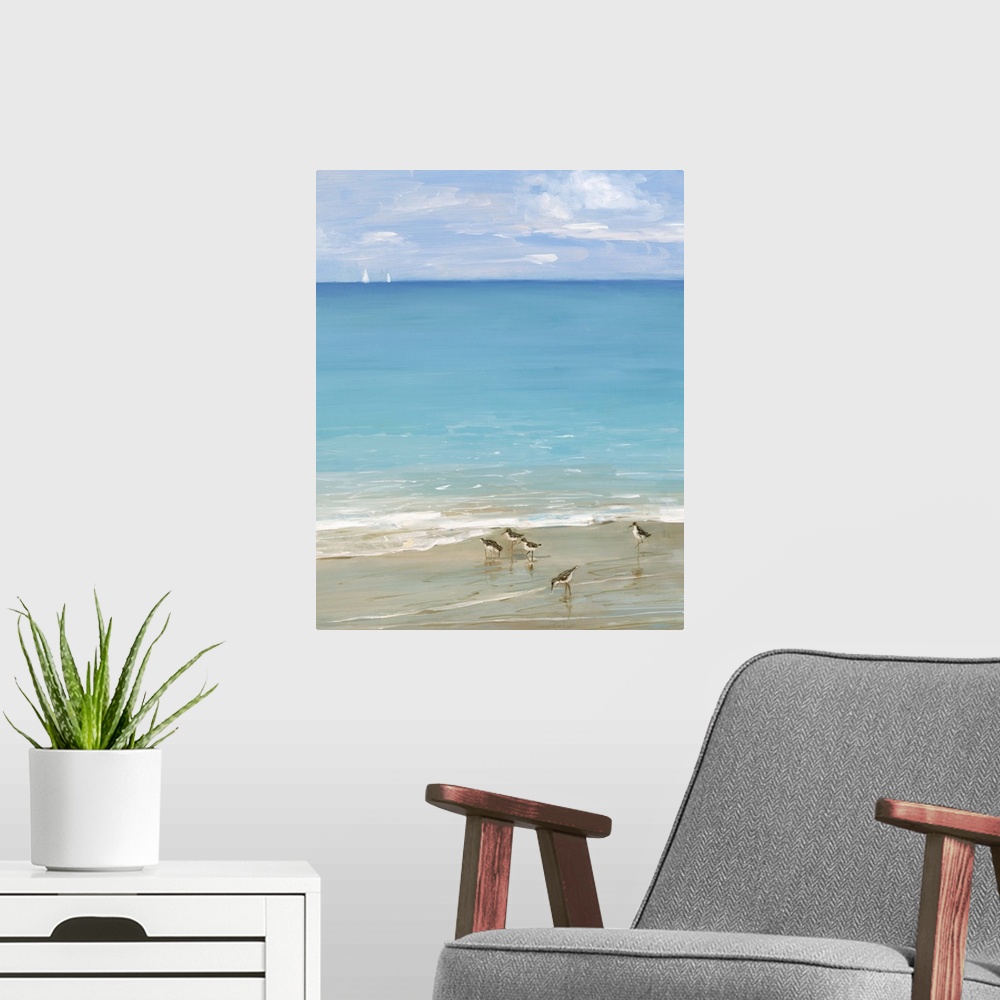 A modern room featuring Contemporary painting of the seashore with seabirds in the foreground and two sailboats in the di...