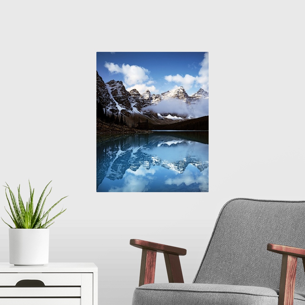 A modern room featuring Moraine Lake surrounded by snow-capped mountains in Banff National Park, Alberta, Canada.