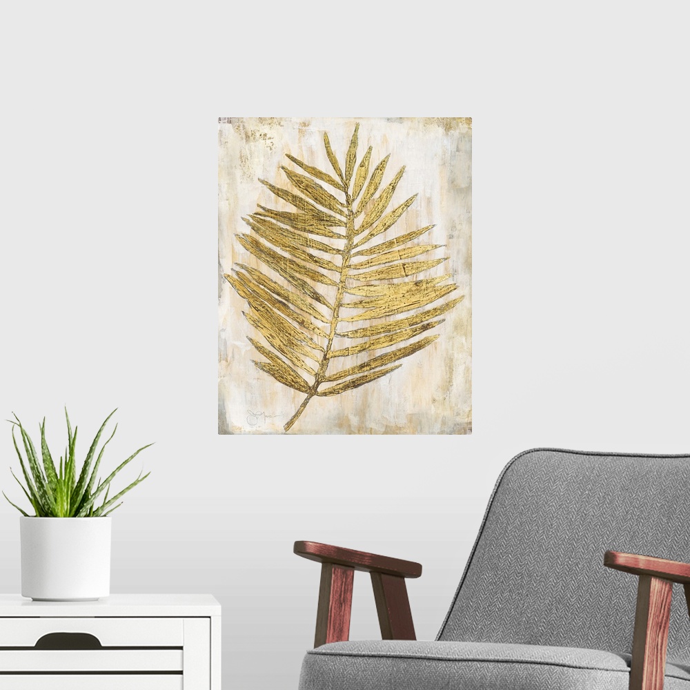 A modern room featuring Gold and cream decor with a palm branch that has thin leaves,