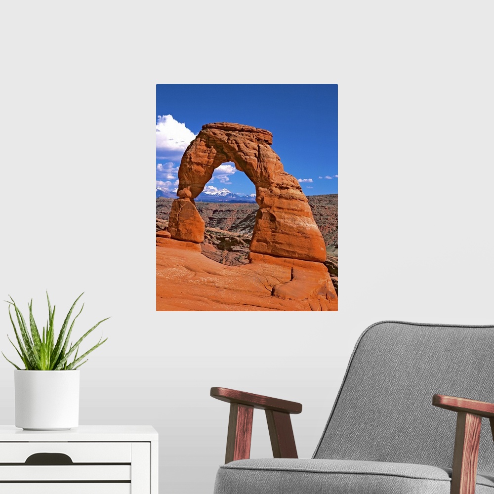 A modern room featuring Bright red natural arch on a cliff in Arches National Park, Utah.