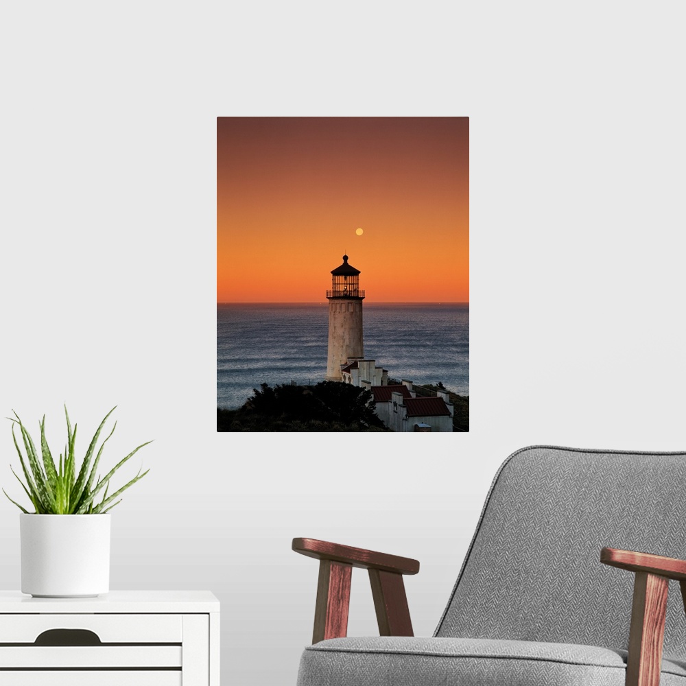 A modern room featuring A lighthouse overlooking the ocean at sunset, Washington.