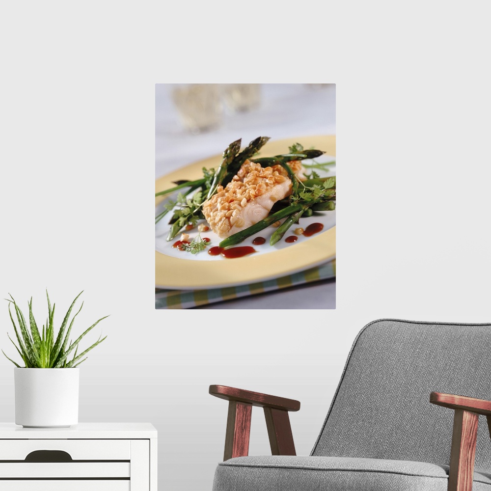 A modern room featuring Asparagus, chervil and fish on plate, close-up