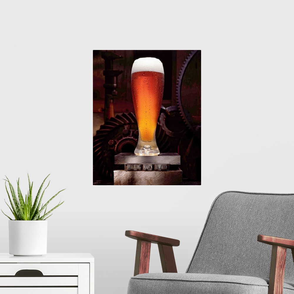 A modern room featuring Vertical, large wall picture of a tall glass of beer, foaming at the top, sitting on a platform t...