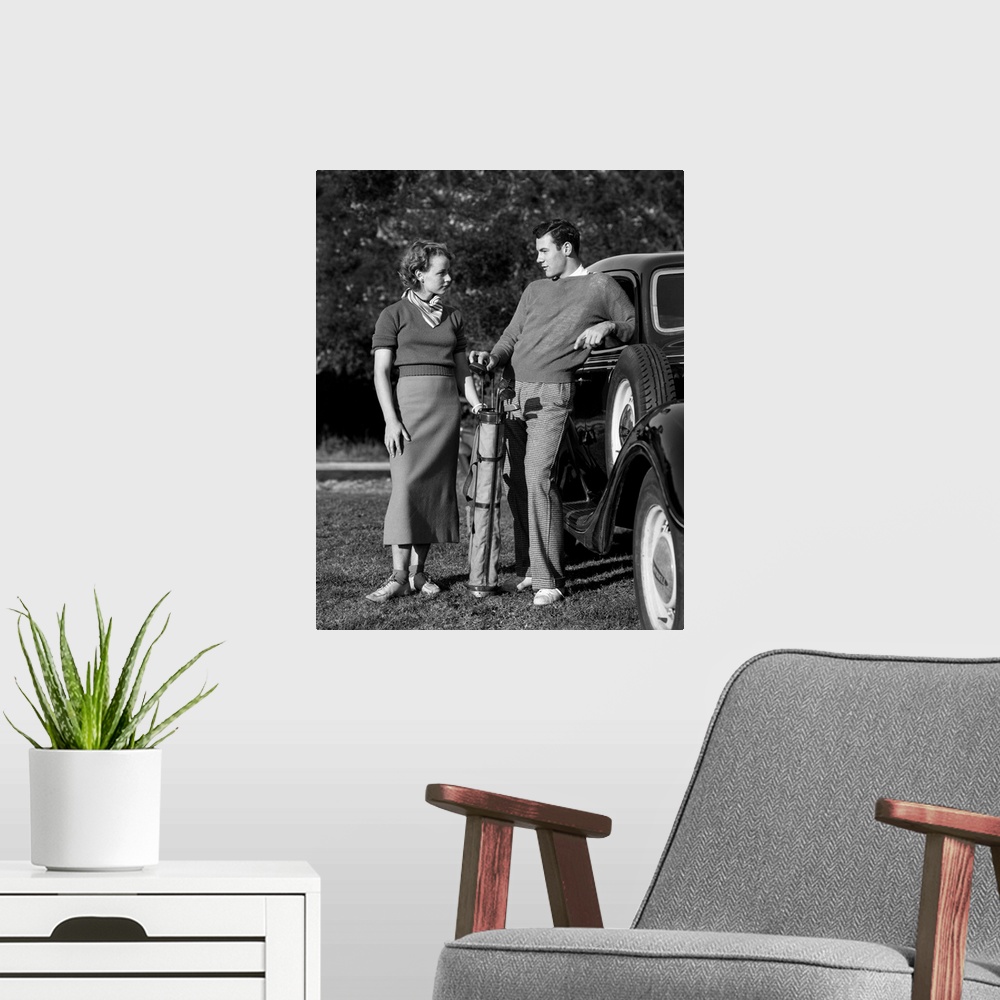 A modern room featuring Photo shows a couple seated during a break in playing tennis. Models: Frederick Weidner and Charl...