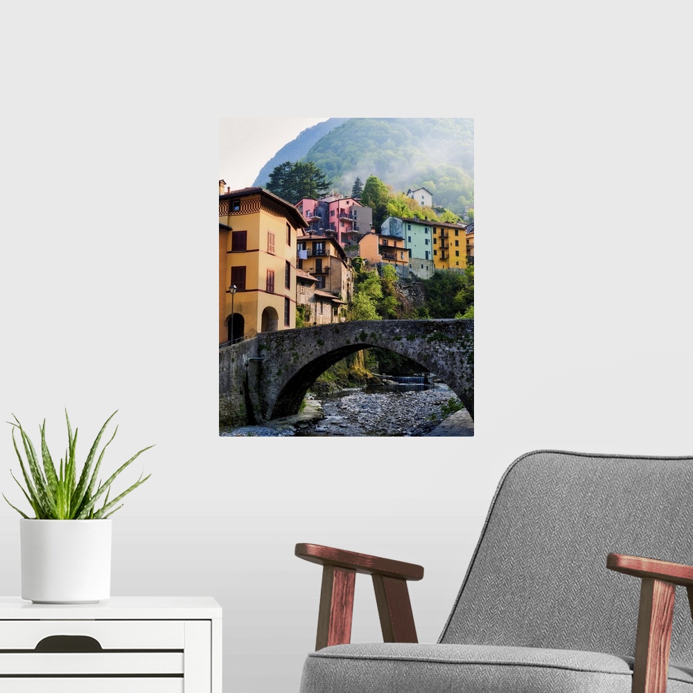 A modern room featuring Fog drifts down mountain and through idealistic village along Lake Como.