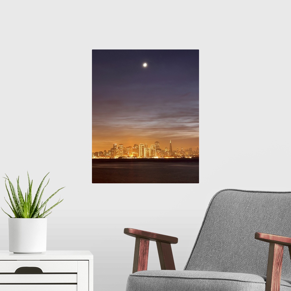 A modern room featuring Moon setting over San Francisco on hazy December evening, taken from Treasure Island.