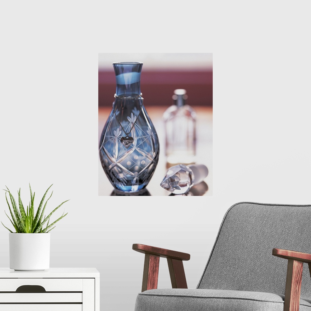 A modern room featuring Ornate Perfume Bottle with Heart Shaped Necklace