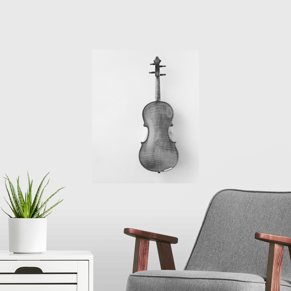 A modern room featuring Violin against white background, close-up