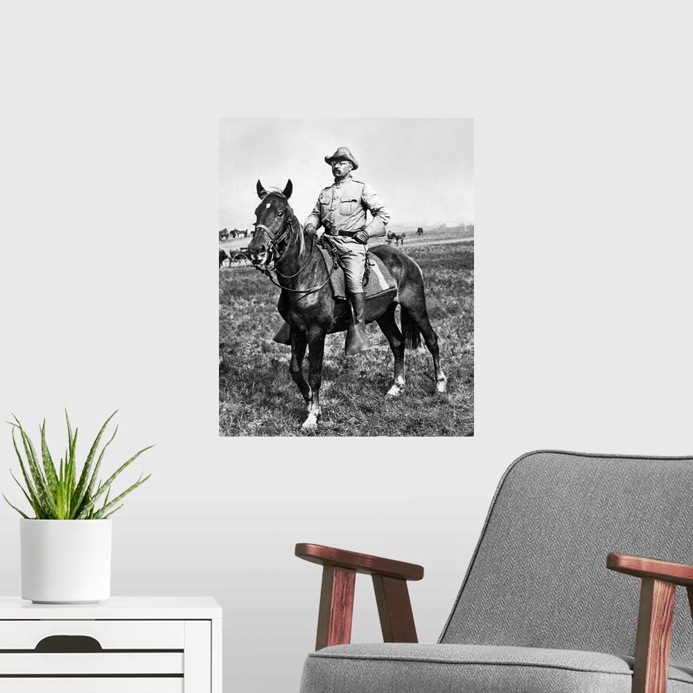 A modern room featuring Young Teddy Roosevelt on horseback during the Spanish-American War. Photo.
