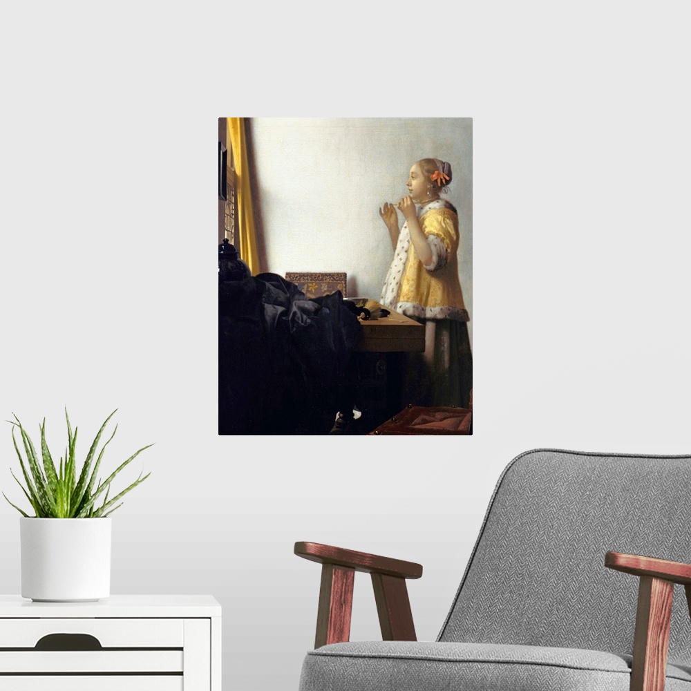 A modern room featuring Jan Vermeer (Dutch, 1632?1675), Young Woman with a Pearl Necklace, circa 1662. Oil on canvas, 45 ...