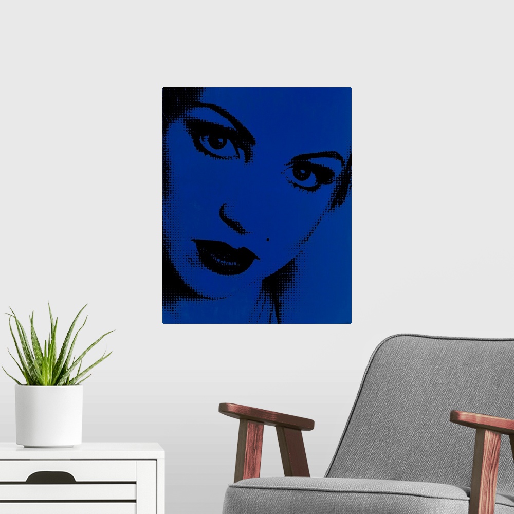 A modern room featuring Blue and black pointillism illustration of a close up woman's face.