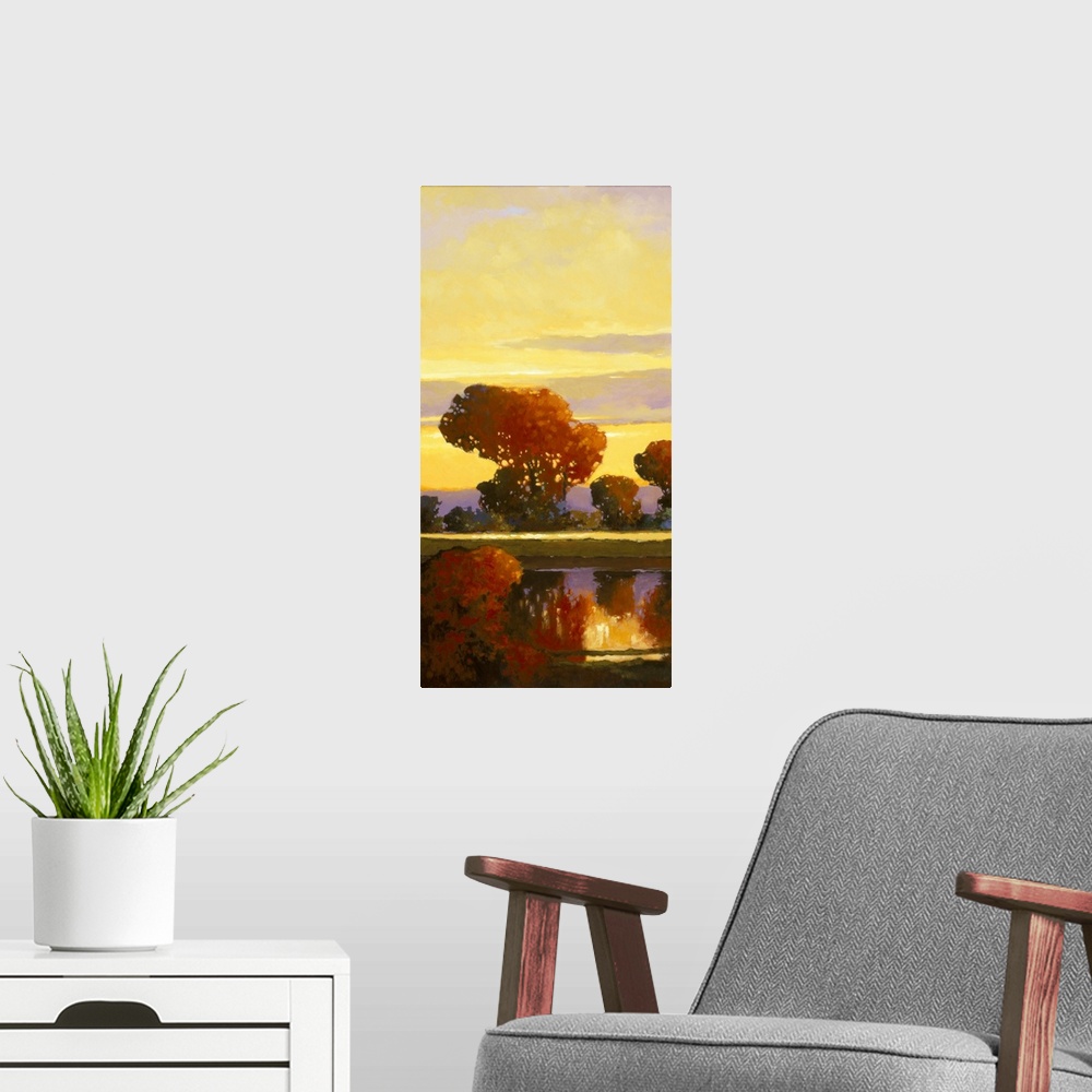 A modern room featuring Contemporary painting of a bright red tree reflected in a calm river.
