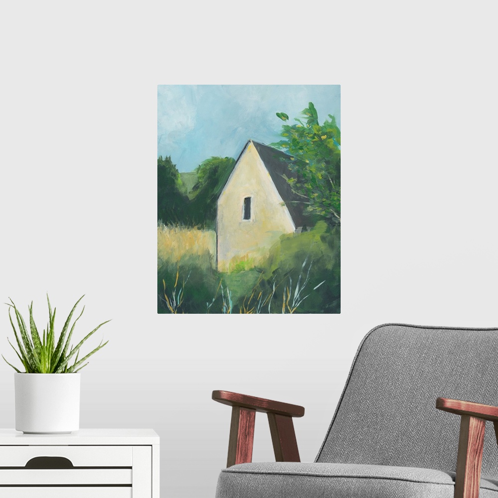 A modern room featuring Vertical painting of a yellow house surround by trees in the country.