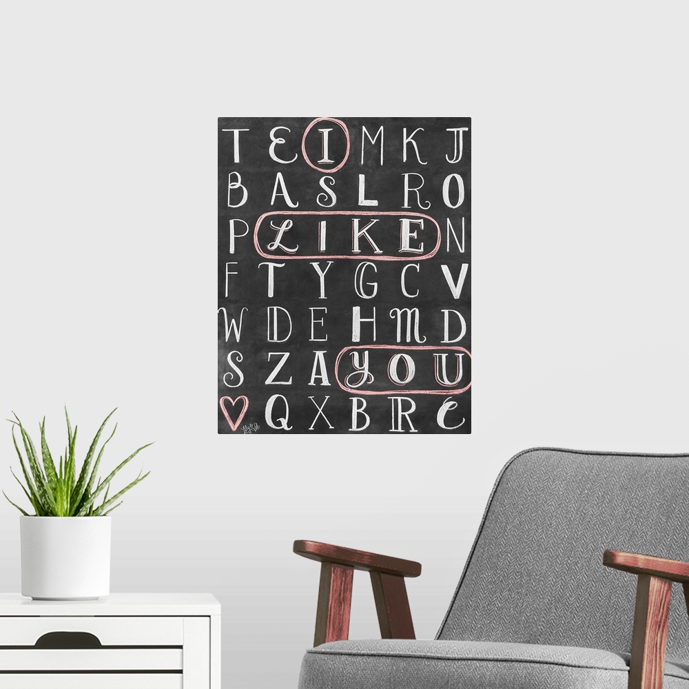 A modern room featuring The words "I Like You" circled in a word-search puzzle, hand written in chalk o na black background.