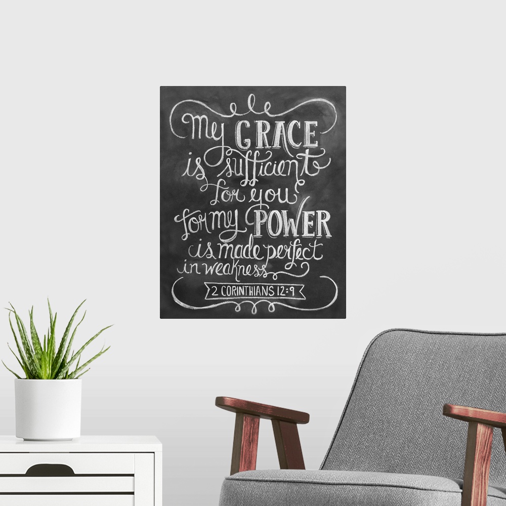 A modern room featuring The Bible passage 2 Corinthians 12:9 handwritten in white chalk on a black background.