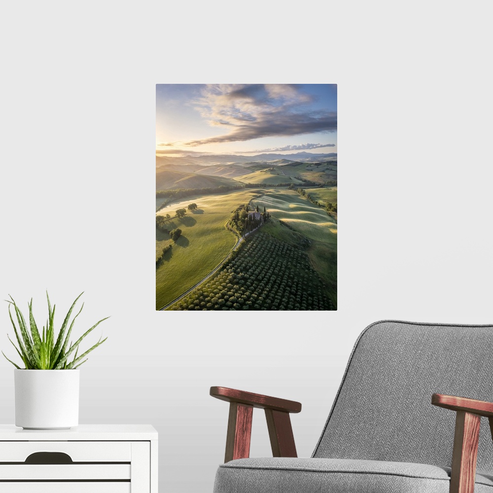 A modern room featuring Podere Belvedere and the surrounding countryside at sunrise. San Quirico d'Orcia, Val d'Orcia, Tu...