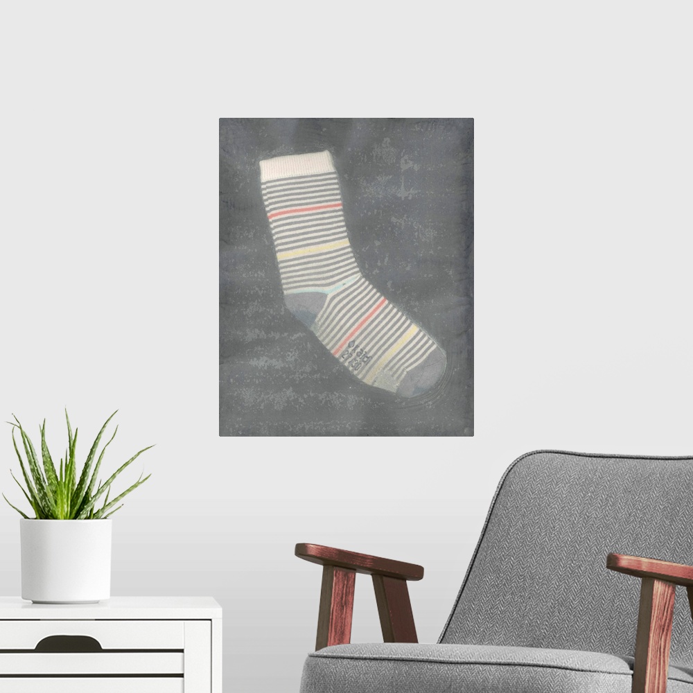 A modern room featuring A worn, striped children's sock suspended in handmade paper.