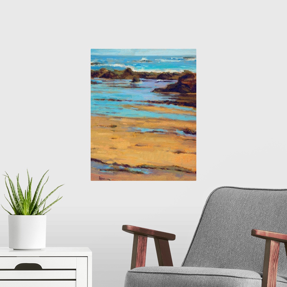 A modern room featuring Vertical contemporary painting of a rocky beach with vivid blue water.